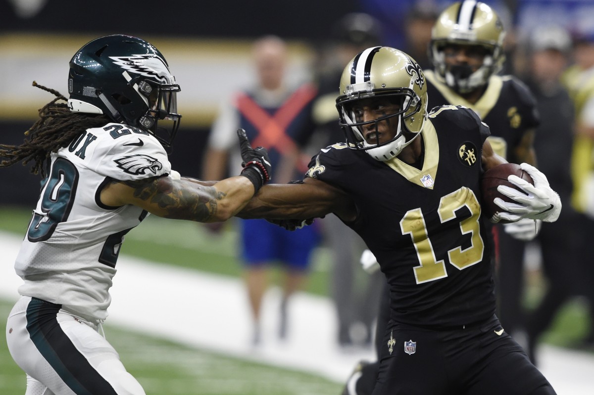 New Orleans Saints wide receiver Michael Thomas (13) stiff arms Eagles safety Avonte Maddox (29). Mandatory Credit: John David Mercer-USA TODAY Sports