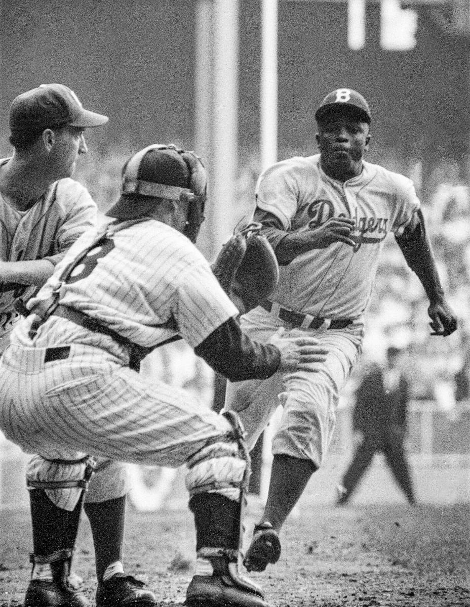 Jackie Robinson stealing home in 1956 World Series