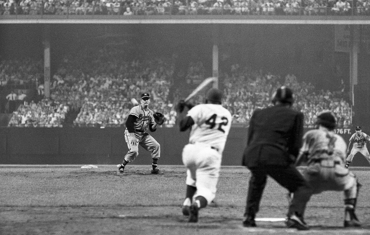 Brooklyn Dodgers second baseman Jackie Robinson (42) swings at the ball from a Milwaukee Braves pitcher during the game on Thursday, August 2, 1956, in Brooklyn, N.Y. Brooklyn defeated Milwaukee, 3-0.