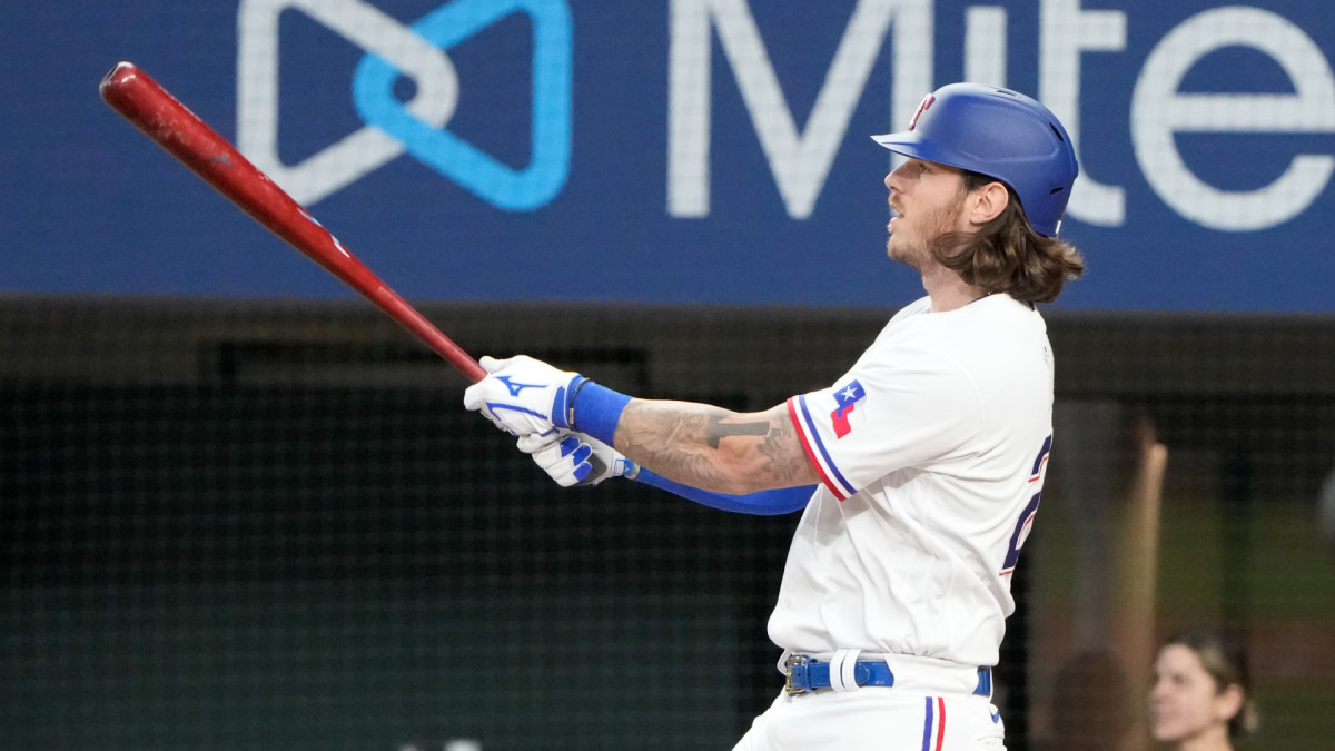 Apr 14, 2022; Arlington, Texas, USA; Texas Rangers catcher Jonah Heim (28) follows thorough on his grand slam home run against the Los Angeles Angels during the fourth inning of a baseball game at Globe Life Field. Mandatory Credit: Jim Cowsert-USA TODAY Sports