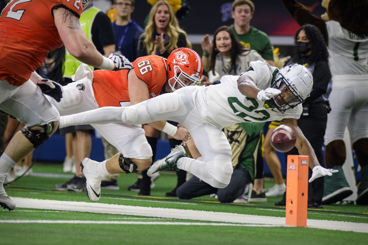 Dec 4, 2021; Arlington, TX, USA; Baylor Bears safety JT Woods (22) dives for the end zone pylon as he returns an interception against the Oklahoma State Cowboys during the first quarter in the Big 12 Conference championship game at AT&T Stadium.
