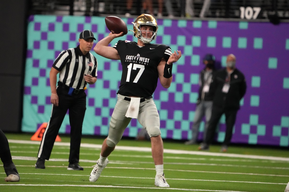 Feb 3, 2022; Las Vegas, NV, USA; West quarterback Jack Coan of Notre Dame (17) throws the ball against the Eastin the first half of the East-West Shrine Bowl at Allegiant Stadium.