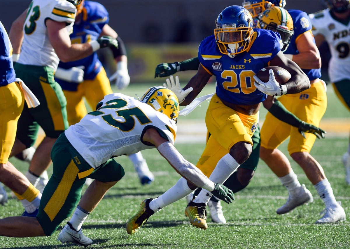 South Dakota State's Pierre Strong, Jr. avoids a tackle by North Dakota State's Michael Tutsie. Erin Woodiel / Argus Leader / USA TODAY NETWORK