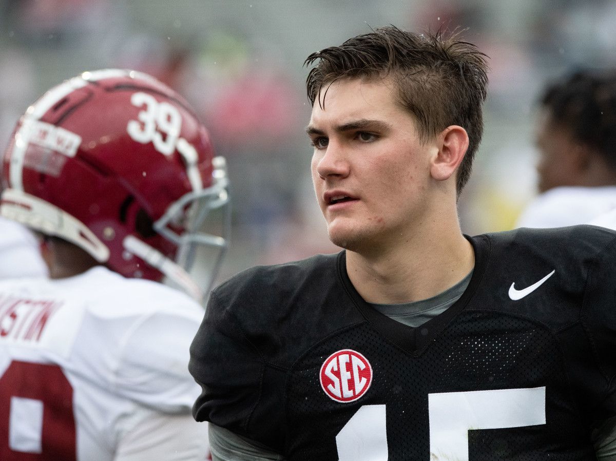 White Team quarterback Ty Simpson (15) greets defenders coming off the field during the A-Day game at Bryant-Denny Stadium.