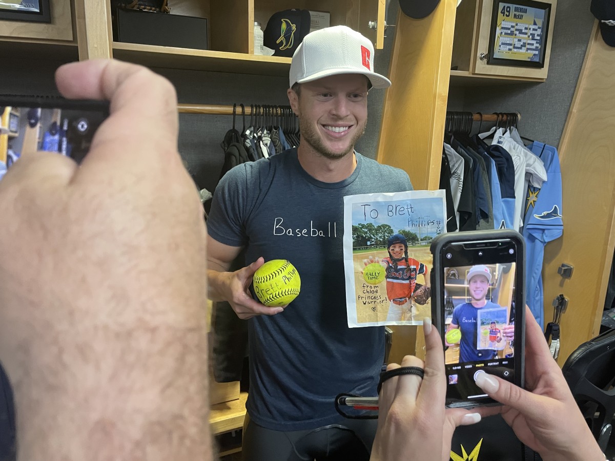 Brett Phillips was near tears when he showed off the gifts he got from 8-year-old cancer patient Chloe Grimes.