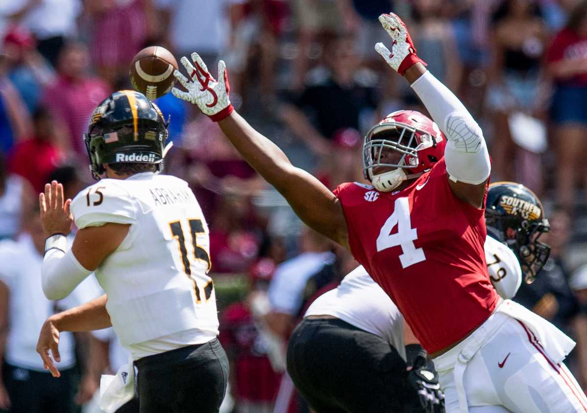 Caption:Alabama linebacker Christopher Allen (4) pressures Southern Miss quarterback Jack Abraham (15) at Bryant-Denny Stadium in Tuscaloosa, Ala., on Saturday September 21, 2019.