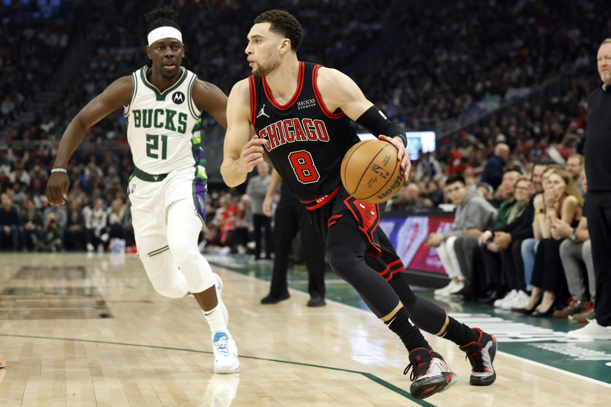 Apr 17, 2022; Milwaukee, Wisconsin, USA; Chicago Bulls guard Zach LaVine (8) drives for the basket in front of Milwaukee Bucks guard Jrue Holiday (21) during the first quarter during game one of the first round for the 2022 NBA playoffs at Fiserv Forum. Mandatory Credit: Jeff Hanisch-USA TODAY Sports
