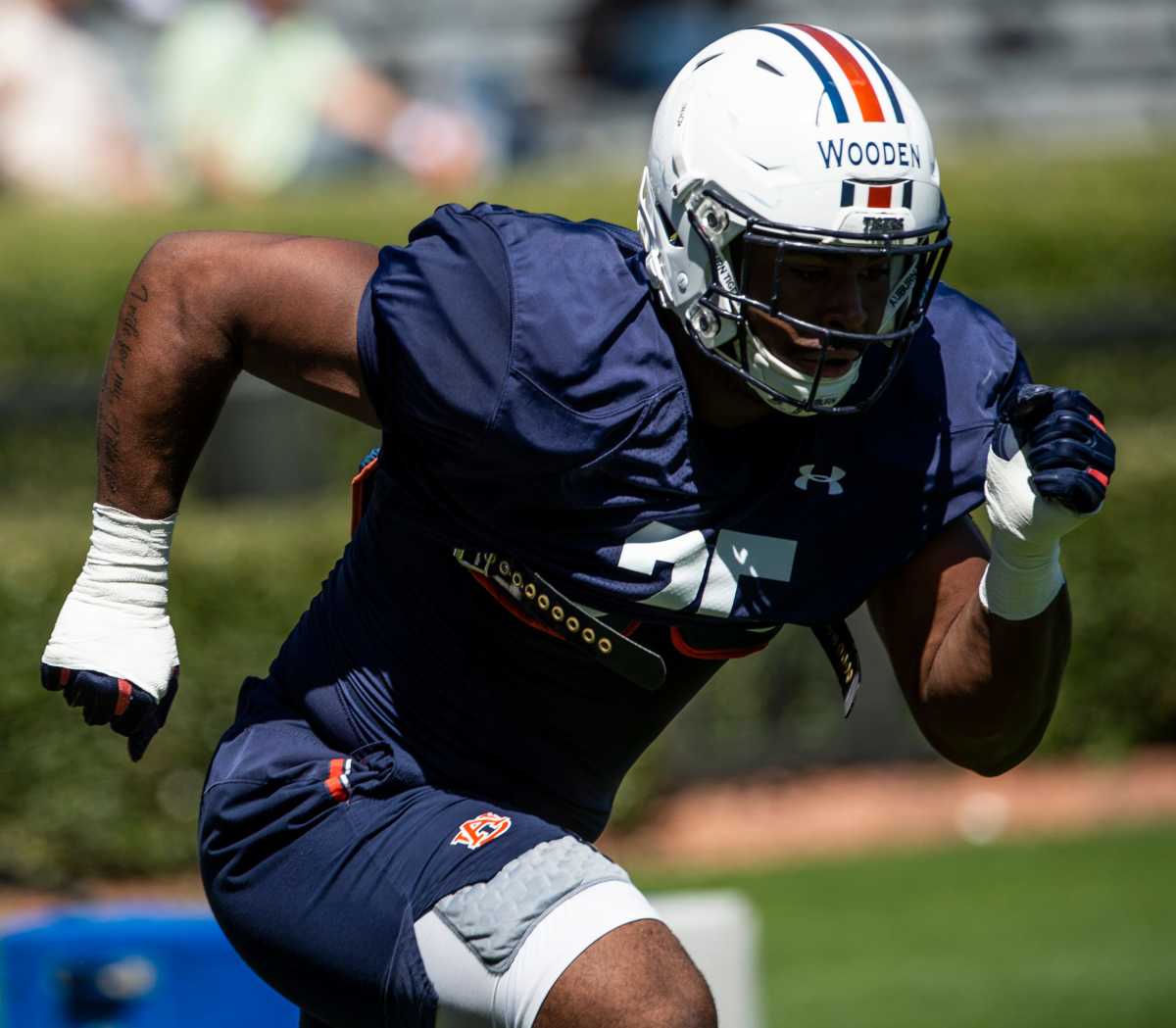 Auburn defensive end Colby Wooden (25) runs drills during an open football practice at Jordan-Hare Stadium in Auburn, Ala., on Saturday, March 20, 2021.