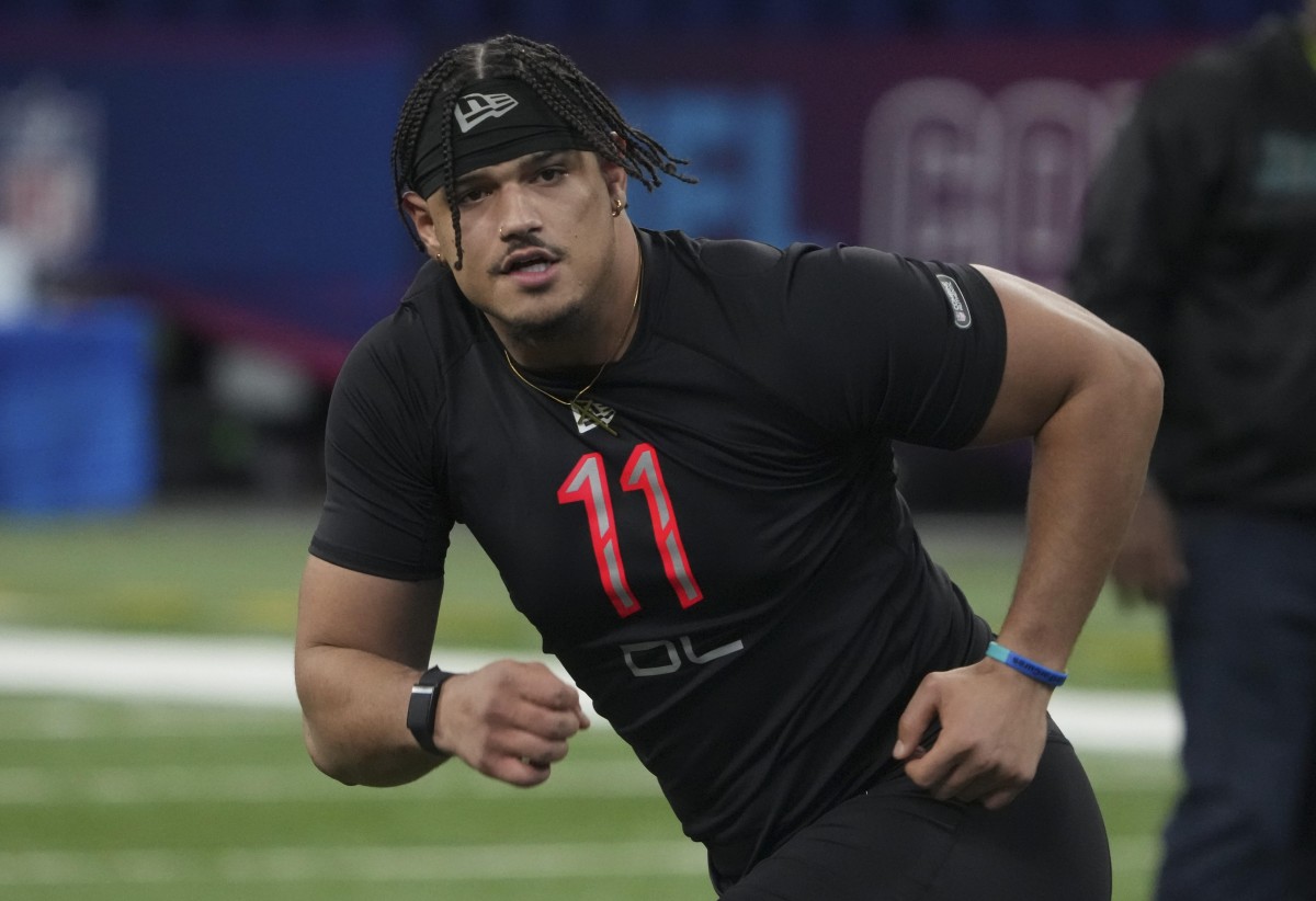 Mar 5, 2022; Indianapolis, IN, USA; Houston defensive lineman Logan Hall (DL11) goes through drills during the 2022 NFL Scouting Combine at Lucas Oil Stadium. Mandatory Credit: Kirby Lee-USA TODAY Sports