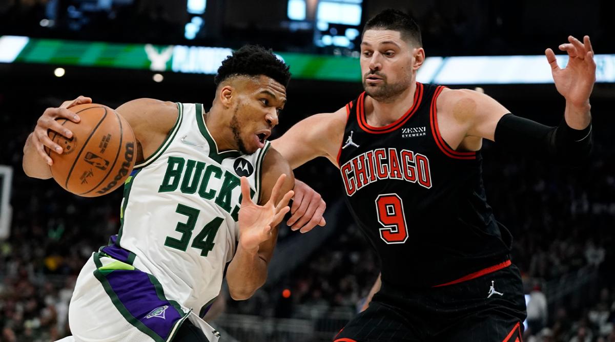 Milwaukee Bucks’ Giannis Antetokounmpo tries to get past Chicago Bulls’ Nikola Vucevic during the first half of Game 1 of their first round NBA playoff basketball game Sunday, April 17, 2022, in Milwaukee.