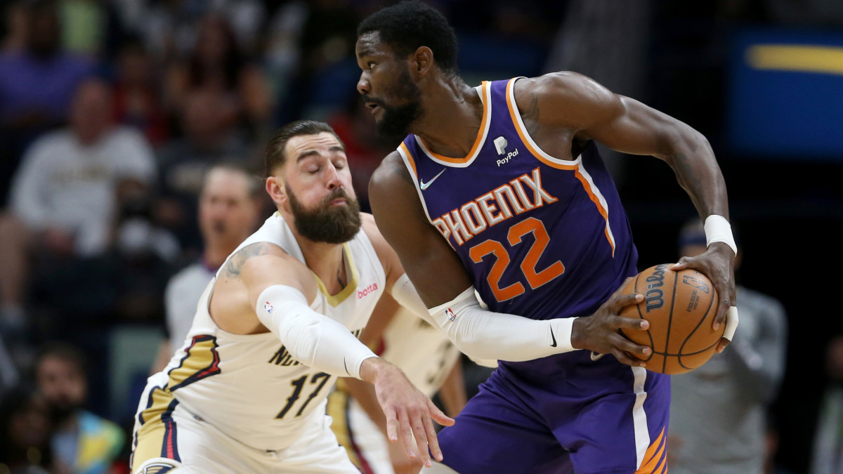 Phoenix Suns center Deandre Ayton is defended by New Orleans Pelicans center Jonas Valanciunas.
