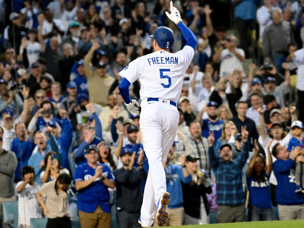 Apr 18, 2022; Los Angeles, California, USA; Los Angeles Dodgers first baseman Freddie Freeman (5) reacts after hitting a home run in the first inning against the Atlanta Braves at Dodger Stadium.