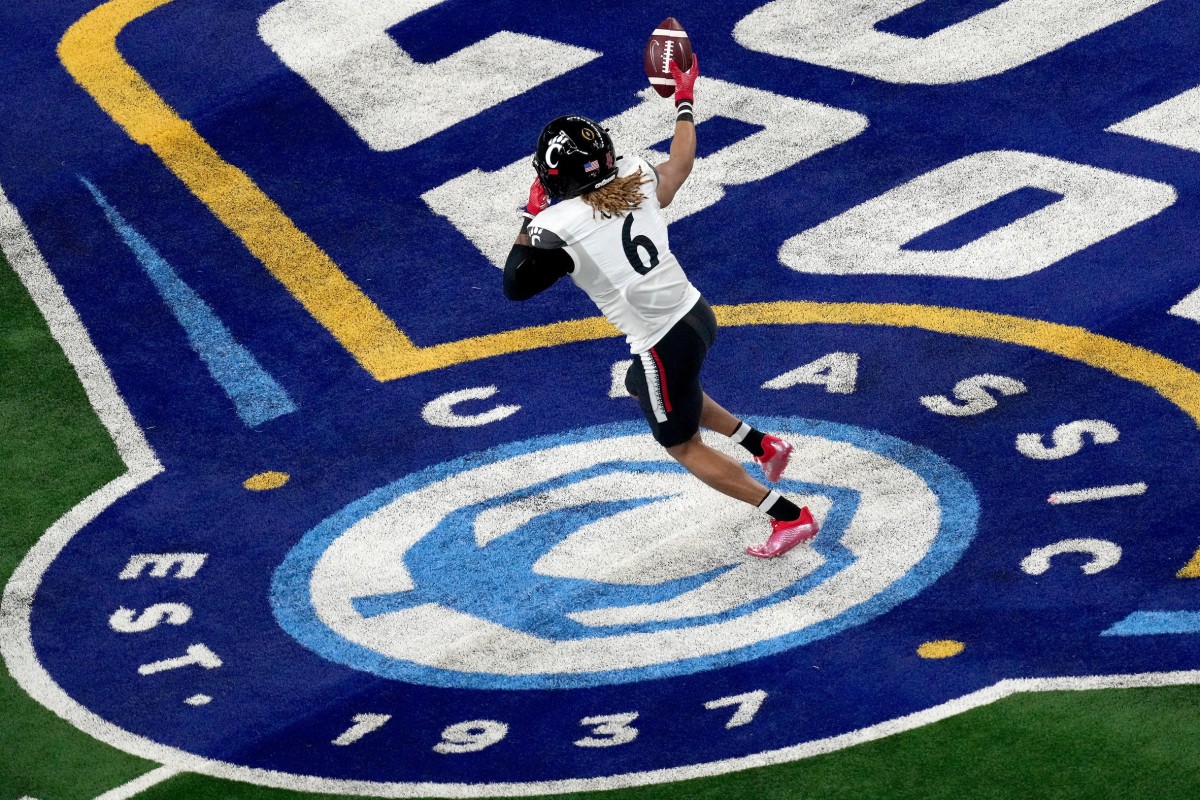 Cincinnati Bearcats safety Bryan Cook (6) reacts after intercepting a pass in the third quarter during the College Football Playoff semifinal game against the Alabama Crimson Tide at the 86th Cotton Bowl Classic, Friday, Dec. 31, 2021, at AT&T Stadium in Arlington, Texas. The Alabama Crimson Tide defeated the Cincinnati Bearcats, 27-6.