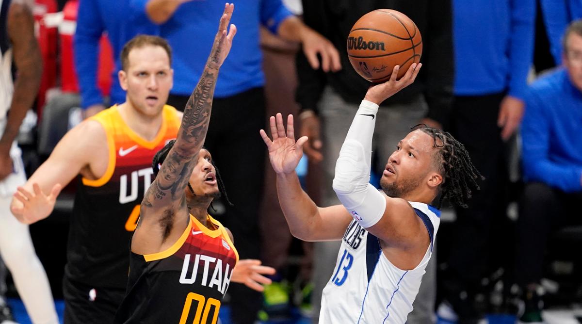 Utah Jazz guard Jordan Clarkson (00) defends against a shot by Dallas Mavericks guard Jalen Brunson (13) in the second half of Game 2 of an NBA basketball first-round playoff series, Monday, April 18, 2022, in Dallas.