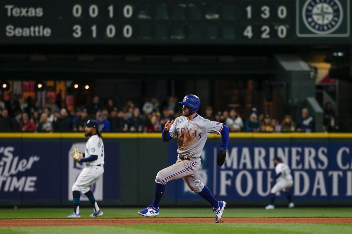 Apr 19, 2022; Seattle, Washington, USA; Texas Rangers center fielder Eli White (41) advances to score a run against the Seattle Mariners during the fifth inning at T-Mobile Park. Mandatory Credit: Joe Nicholson-USA TODAY Sports