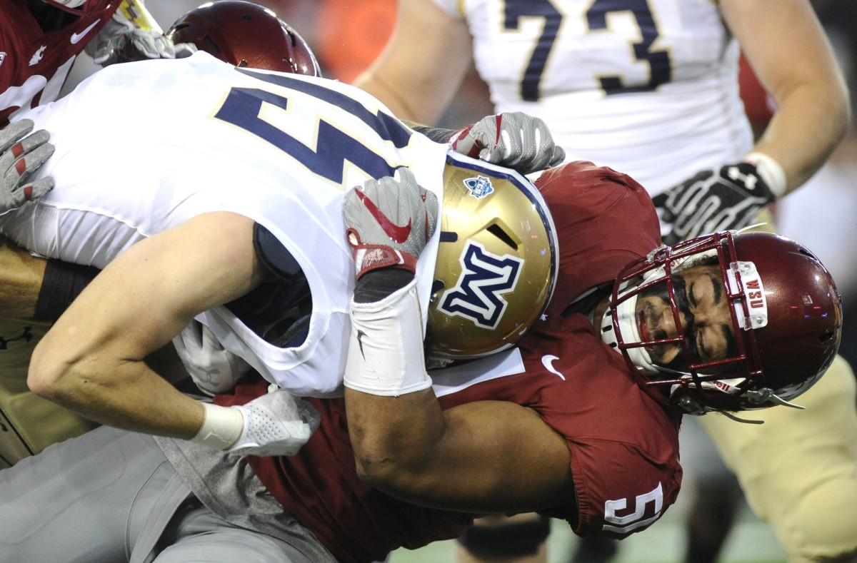 Sep 2, 2017; Pullman, WA, USA; Montana State Bobcats running back Troy Andersen (15) is tackled by Washington State Cougars linebacker Frankie Luvu (51) during the first half at Martin Stadium. Mandatory Credit: James Snook-USA TODAY Sports