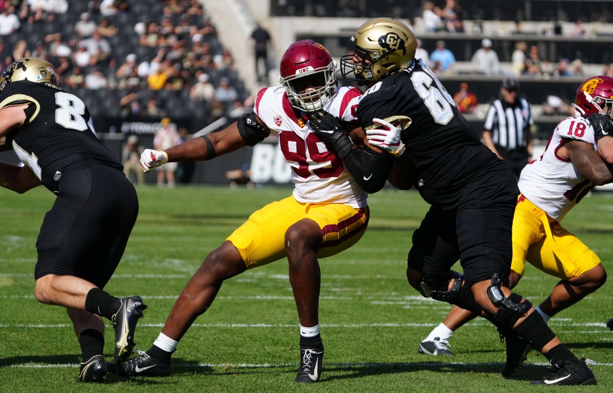 Oct 2, 2021; Boulder, Colorado, USA; USC Trojans linebacker Drake Jackson (99) pass rushes at Colorado Buffaloes offensive lineman Jake Wiley (60) in the second half at Folsom Field. Mandatory Credit: Ron Chenoy-USA TODAY Sports