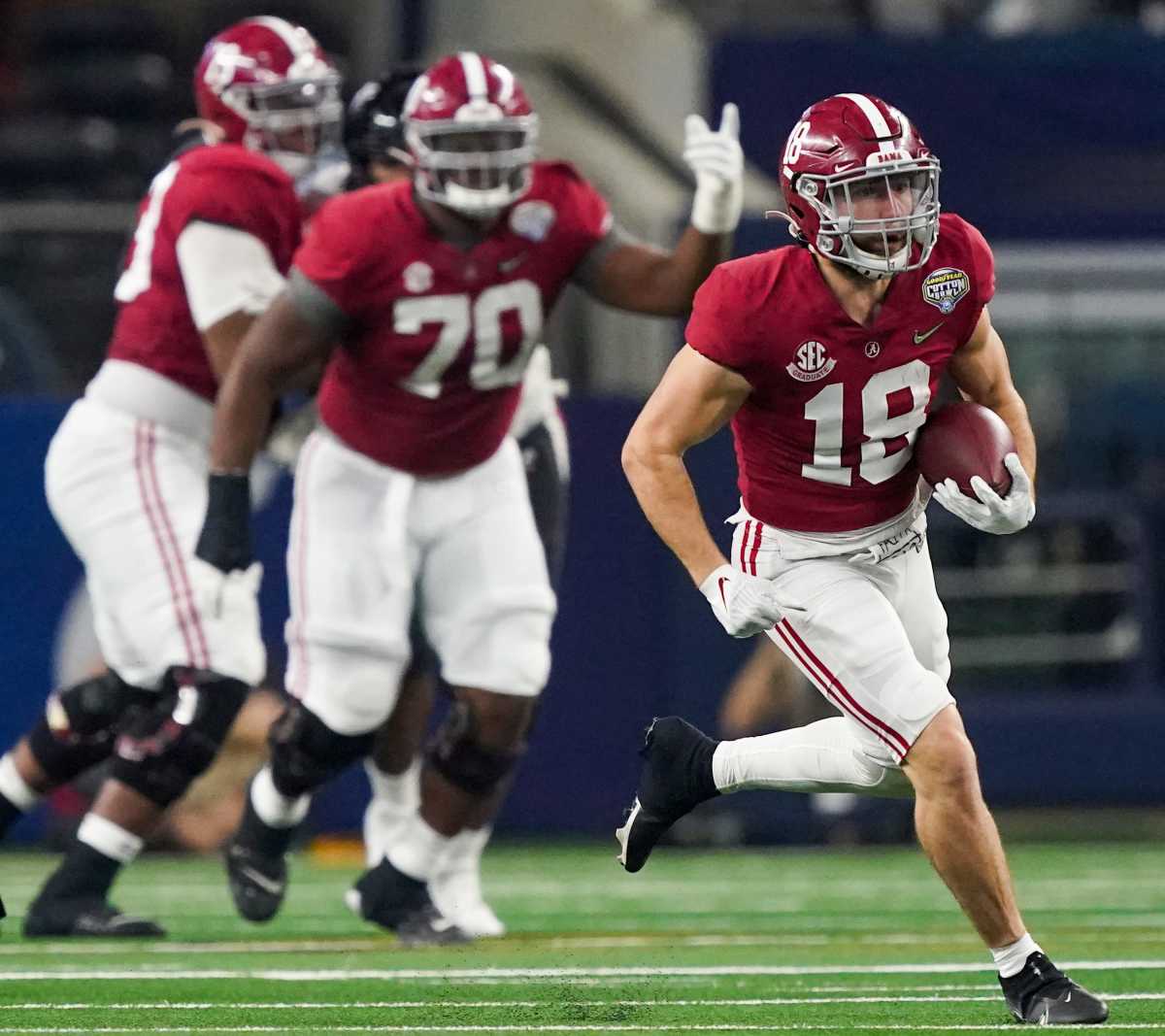 Alabama wide receiver Slade Bolden (18) carries the ball against Cincinnati in the 2021 College Football Playoff Semifinal game at the 86th Cotton Bowl in AT&T Stadium in Arlington, Texas Friday, Dec. 31, 2021.