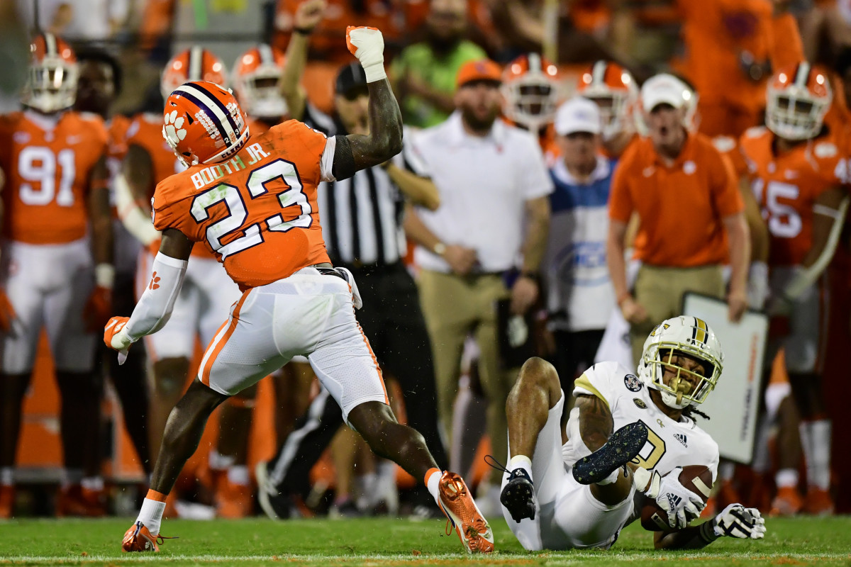 Sep 18, 2021; Clemson, South Carolina, USA; Clemson Tigers cornerback Andrew Booth Jr. (23) celebrates after stopping Georgia Tech Yellow Jackets wide receiver Nate McCollum (8) during the second half at Memorial Stadium. Mandatory Credit: Adam Hagy-USA TODAY Sports