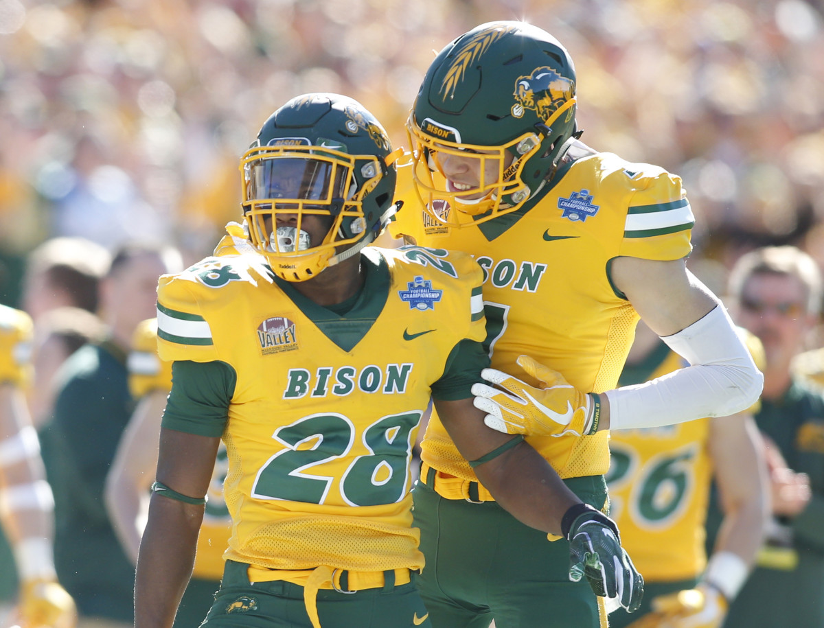 Jan 5, 2019; Frisco, TX, USA; North Dakota State Bison running back Ty Brooks (28) reacts with wide receiver Christian Watson (1) after achieving a first down in the first quarter against the Eastern Washington Eagles in the Division I Football Championship at Toyota Stadium. Mandatory Credit: Tim Heitman-USA TODAY Sports