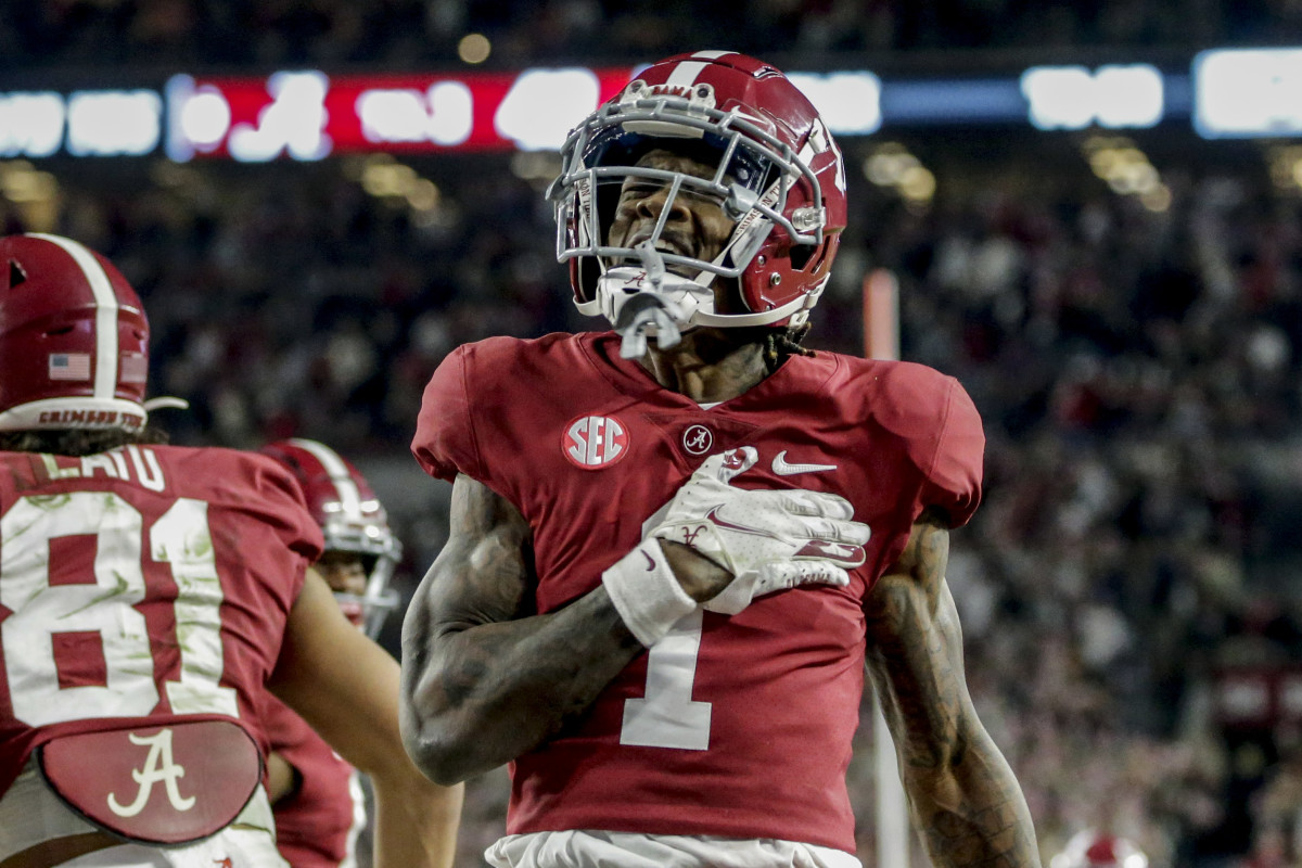 Nov 20, 2021; Tuscaloosa, Alabama, USA; Alabama Crimson Tide wide receiver Jameson Williams (1) reacts after catching a pass for a touchdown against the Arkansas Razorbacks during the second half at Bryant-Denny Stadium. Mandatory Credit: Butch Dill-USA TODAY Sports