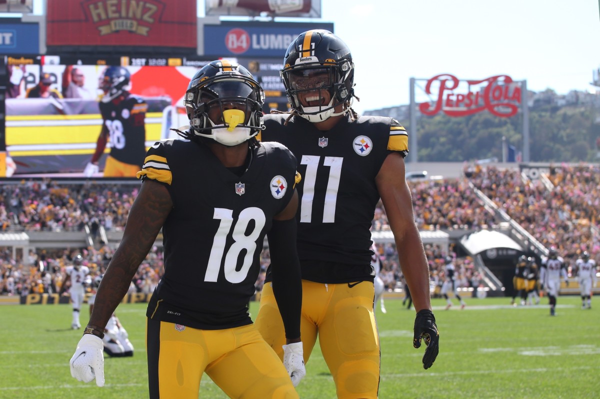Pittsburgh Steelers wide receiver Diontae Johnson (18) celebrates with wide receiver Chase Claypool (11) in the end-zone after catching a fifty yard touchdown pass against the Denver Broncos during the first quarter at Heinz Field.