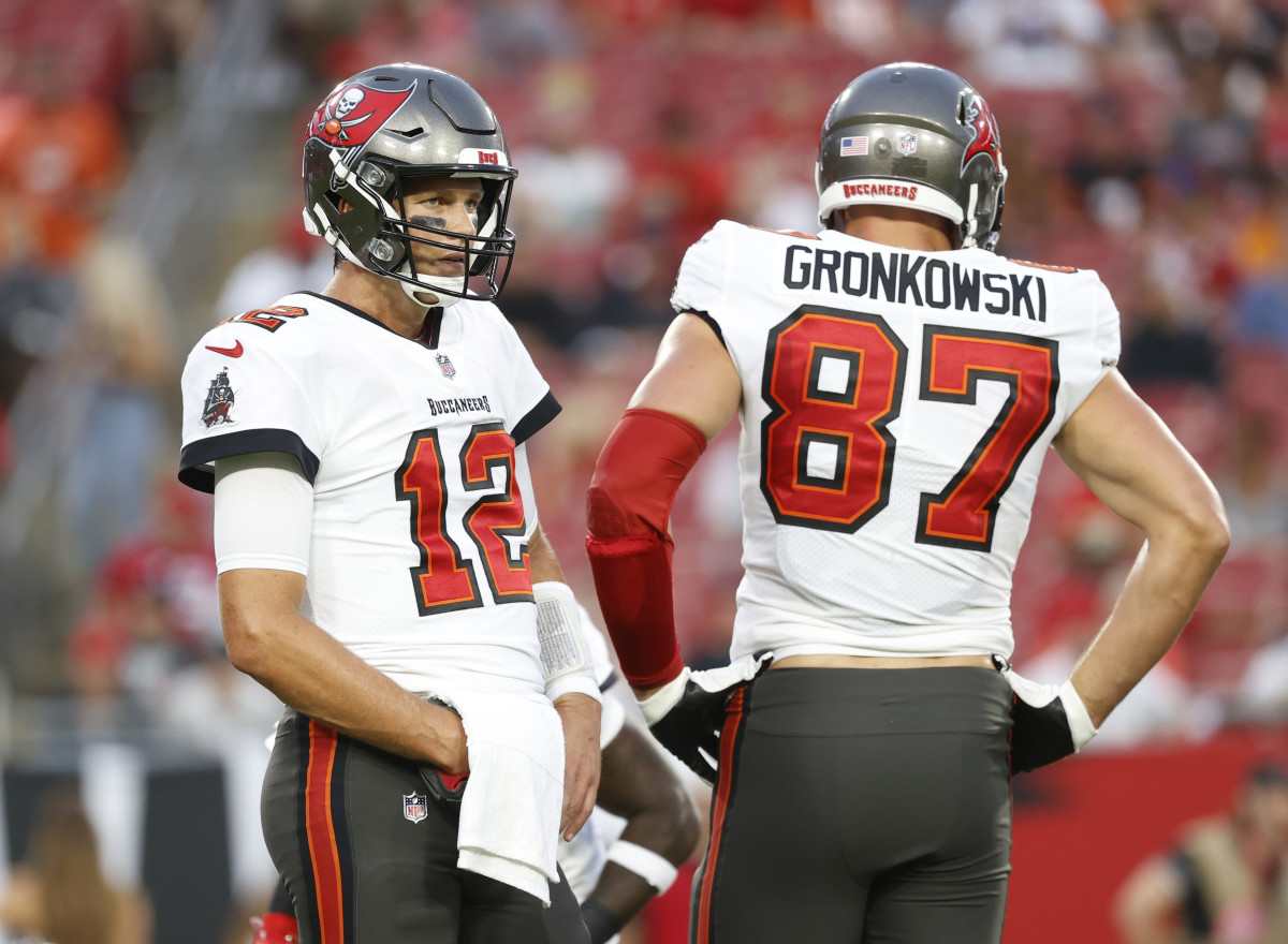 Aug 14, 2021; Tampa, Florida, USA; Tampa Bay Buccaneers quarterback Tom Brady (12) and tight end Rob Gronkowski (87) looks on against the Cincinnati Bengals during the first quarter at Raymond James Stadium. Mandatory Credit: Kim Klement-USA TODAY Sports