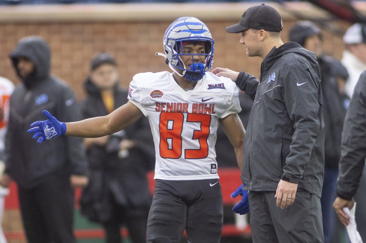 American wide receiver Calvin Austin III of Memphis (83) talks with a coach during American practice for the 2022 Senior Bowl in Mobile, AL, USA.