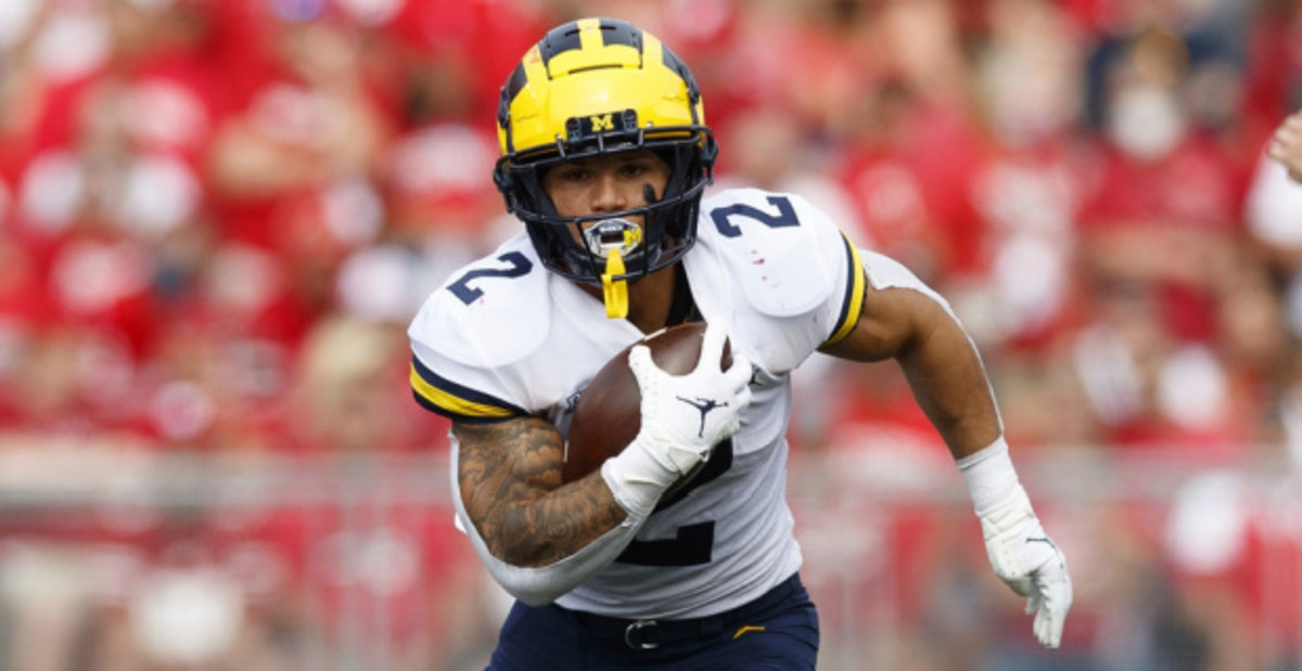 Michigan Wolverines running back Blake Corum on a rushing attempt during a college football game in the Big Ten.