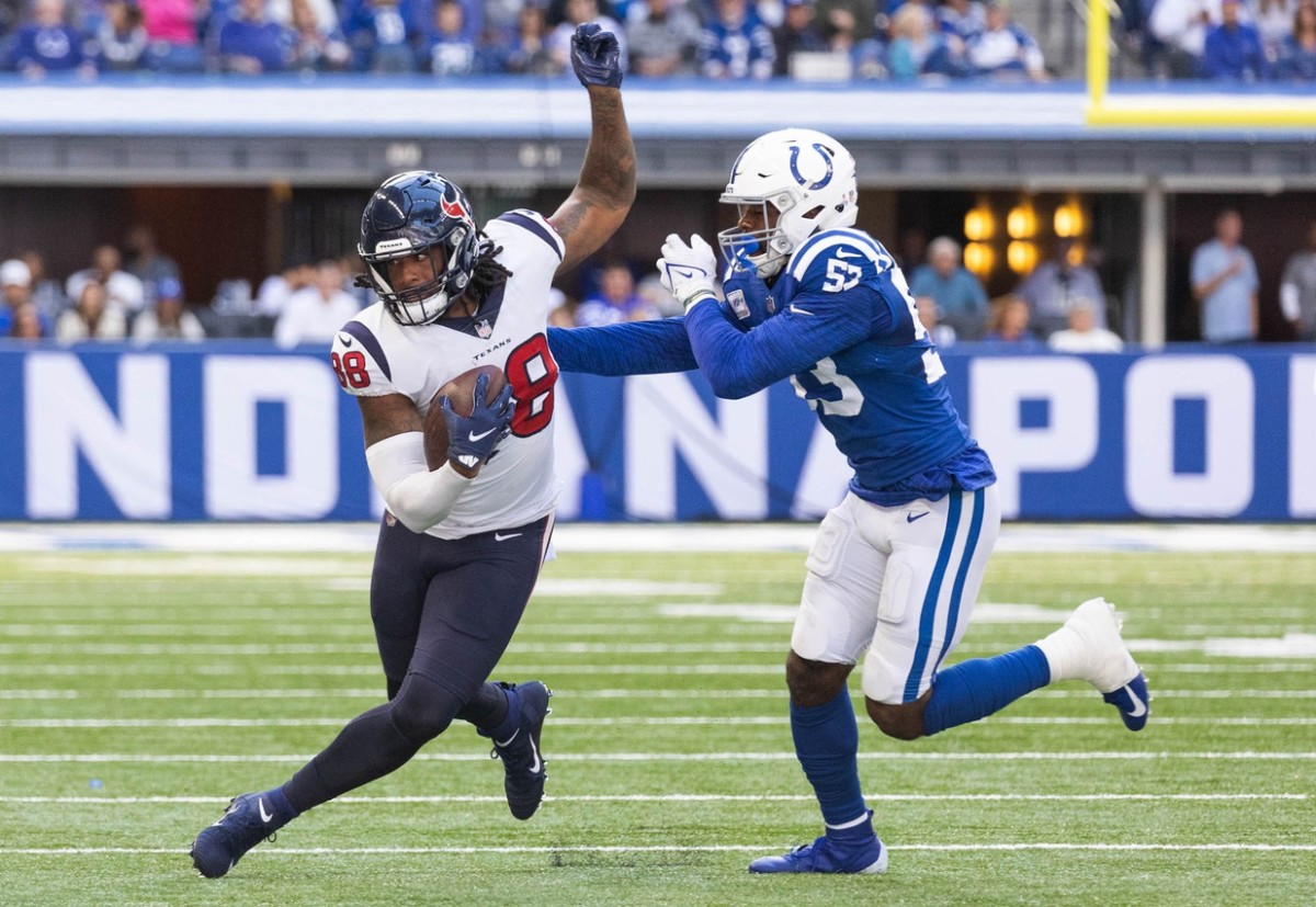 Oct 17, 2021; Indianapolis, Indiana, USA; Houston Texans tight end Jordan Akins (88) runs with the ball while Indianapolis Colts outside linebacker Darius Leonard (53) defends in the second half at Lucas Oil Stadium.