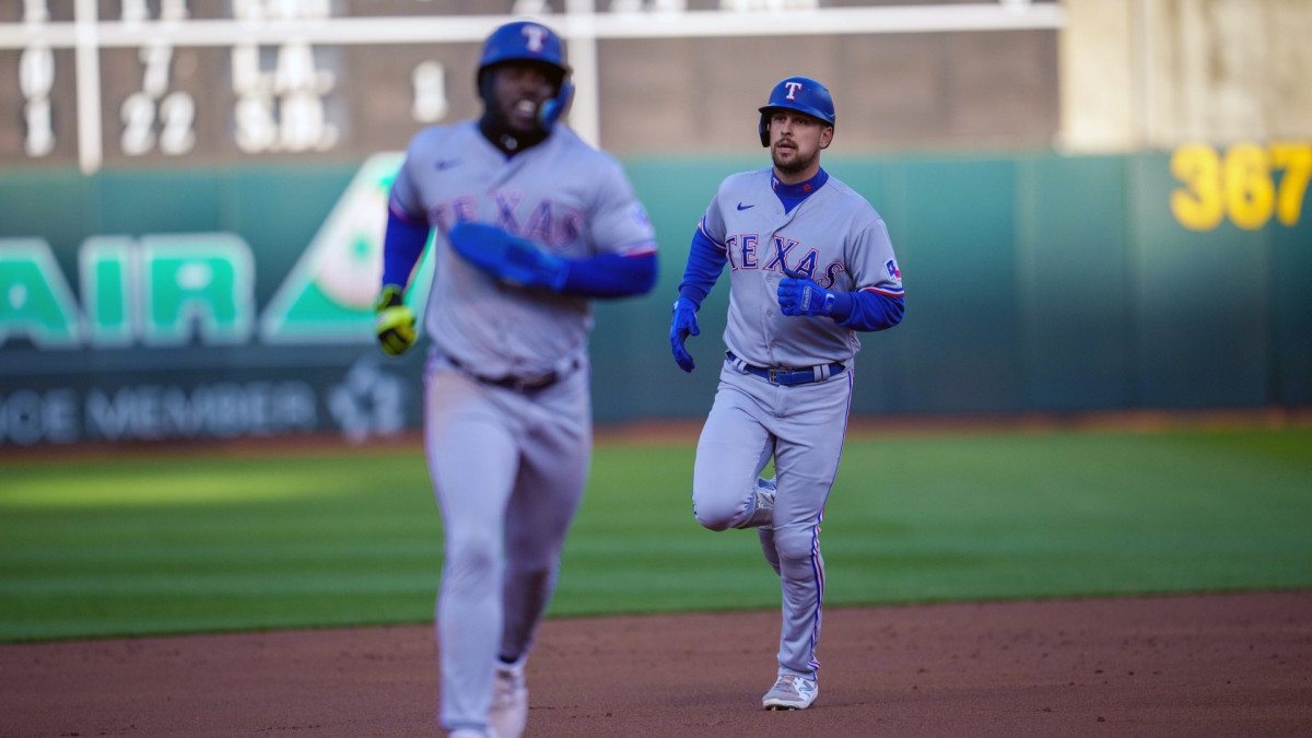 Apr 22, 2022; Oakland, California, USA; Texas Rangers first baseman Nathaniel Lowe (30) circles the bases after hitting a two run home run during the second inning against the Oakland Athletics at RingCentral Coliseum. Mandatory Credit: Neville E. Guard-USA TODAY Sports