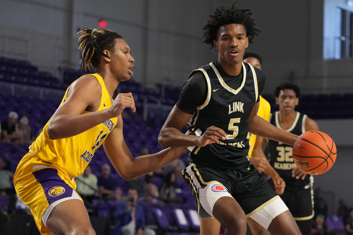 Apr 2, 2022; Fort Myers, FL, USA; Link Academy Lions forward Julian Phillips (5) dribbles the ball around Montverde Academy Eagles forward Malik Reneau (14) during the first half at Suncoast Credit Union Arena. Mandatory Credit: Jasen Vinlove-USA TODAY Sports