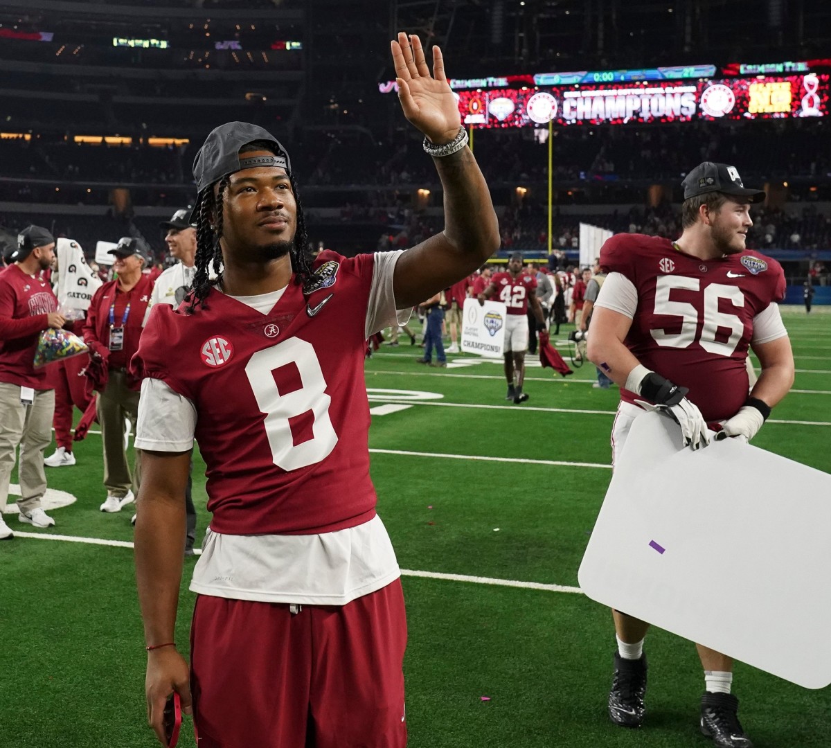 Alabama wide receiver John Metchie III (8) waves to fans after the 2021 College Football Playoff Semifinal game at the 86th Cotton Bowl in AT&T Stadium in Arlington, Texas Friday, Dec. 31, 2021. Alabama defeated Cincinnati 27-6 to advance to the national championship game.