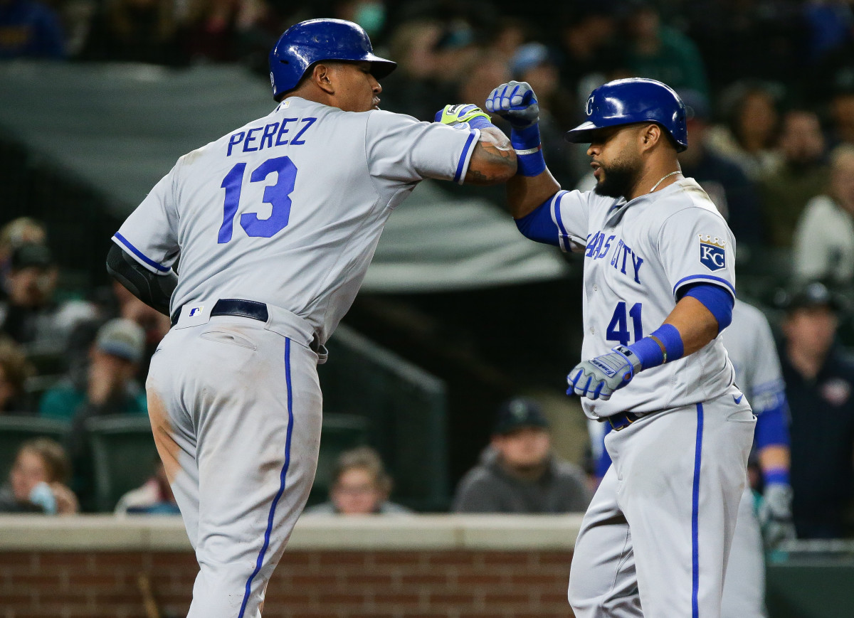 Apr 23, 2022; Seattle, Washington, USA; Kansas City Royals catcher Salvador Perez (13) greets first baseman Carlos Santana (41) after Santana hit a two-run home run during the seventh inning against the Seattle Mariners at T-Mobile Park. Mandatory Credit: Lindsey Wasson-USA TODAY Sports