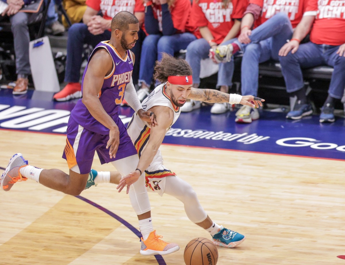 Jose Alvarado steals the ball from Phoenix Suns guard Chris Paul