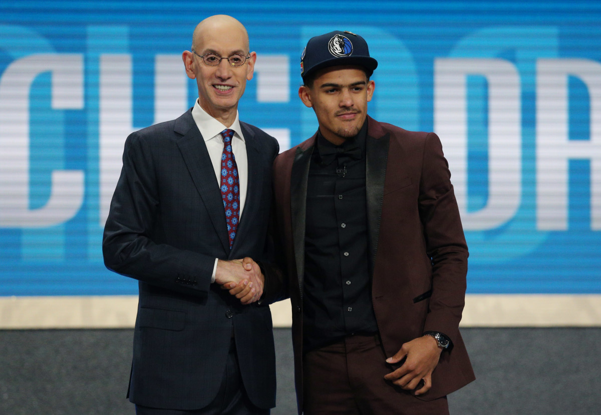 Trae Young (Oklahoma) greets NBA commissioner Adam Silver after being selected as the number five overall pick to the Dallas Mavericks in the first round of the 2018 NBA Draft at the Barclays Center.