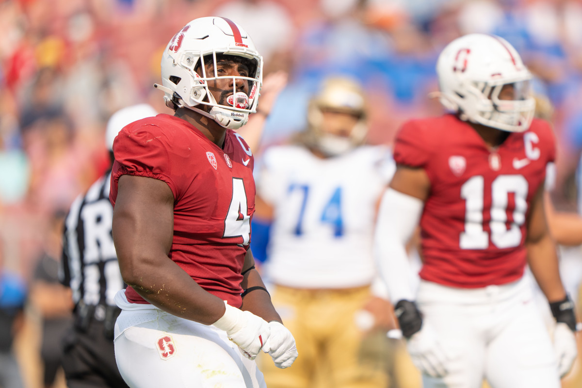 Sep 25, 2021; Stanford, California, USA; Stanford Cardinal defensive end Thomas Booker (4) celebrates during the first quarter against the UCLA Bruins at Stanford Stadium. Mandatory Credit: Stan Szeto-USA TODAY Sports