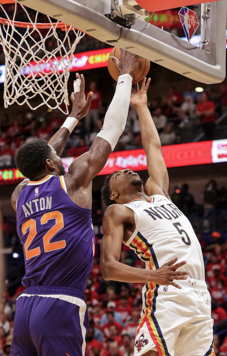 Apr 24, 2022; New Orleans, Louisiana, USA; Phoenix Suns center Deandre Ayton (22) blocks the shot of New Orleans Pelicans forward Herbert Jones (5) during the second half of game four of the first round of the 2022 NBA playoffs at Smoothie King Center. Mandatory Credit: Stephen Lew-USA TODAY Sports