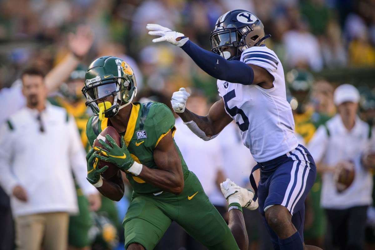 Baylor receiver Tyquan Thornton (9) catches a pass as Brigham Young defensive back D'Angelo Mandell (5). Mandatory Credit: Jerome Miron-USA TODAY Sports