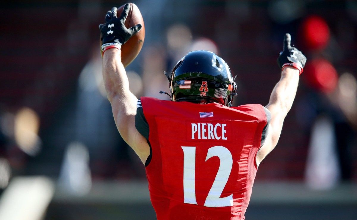 Cincinnati Bearcats wide receiver Alec Pierce (12) gestures toward an official after catching a touchdown pass during the first quarter of a college football game against the Memphis Tigers, Saturday, Oct. 31, 2020, at Nippert Stadium in Cincinnati.