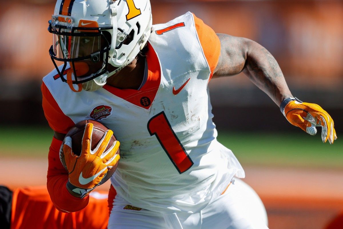 American squad wide receiver Velus Jones Jr. of Tennessee (1) runs with the ball in the first half against the National squad during the Senior bowl at Hancock Whitney Stadium.
