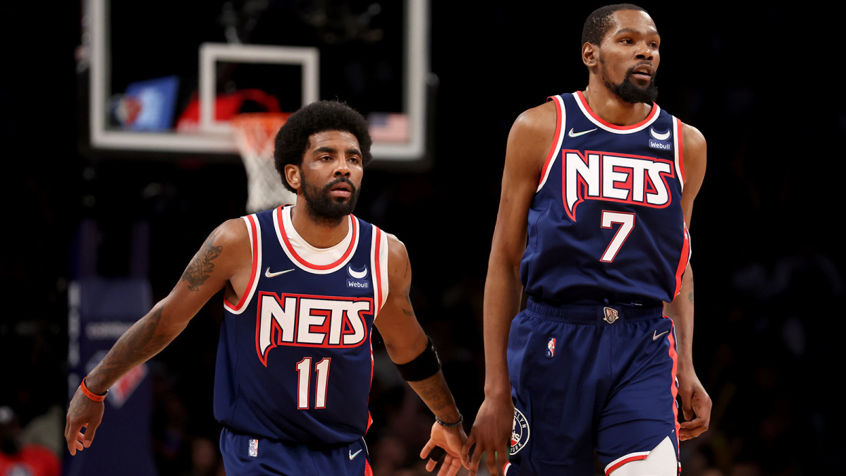 Brooklyn Nets guard Kyrie Irving (11) and forward Kevin Durant (7) drop back on defense.