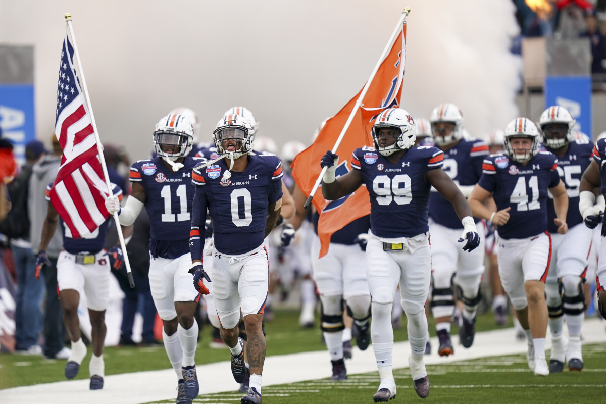 Dec 28, 2021; Birmingham, Alabama, USA; Auburn Tigers wide receiver Demetris Robertson (0) leads his team onto the field prior to the 2021 Birmingham Bowl against Houston Cougars at Protective Stadium. Mandatory Credit: Marvin Gentry-USA TODAY Sports