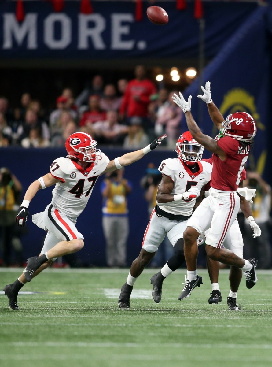 Alabama receiver John Metchie III (8) catches a pass against the Georgia Bulldogs during the SEC championship game. Mandatory Credit: Brett Davis-USA TODAY Sports