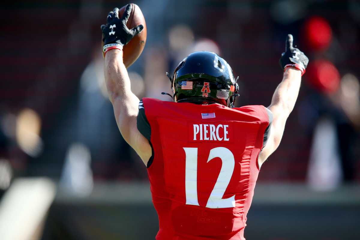 Cincinnati Bearcats wide receiver Alec Pierce (12) gestures toward an official after catching a touchdown pass during the first quarter of a college football game against the Memphis Tigers, Saturday, Oct. 31, 2020, at Nippert Stadium in Cincinnati. Ncaa Football Memphis At Cincinnati