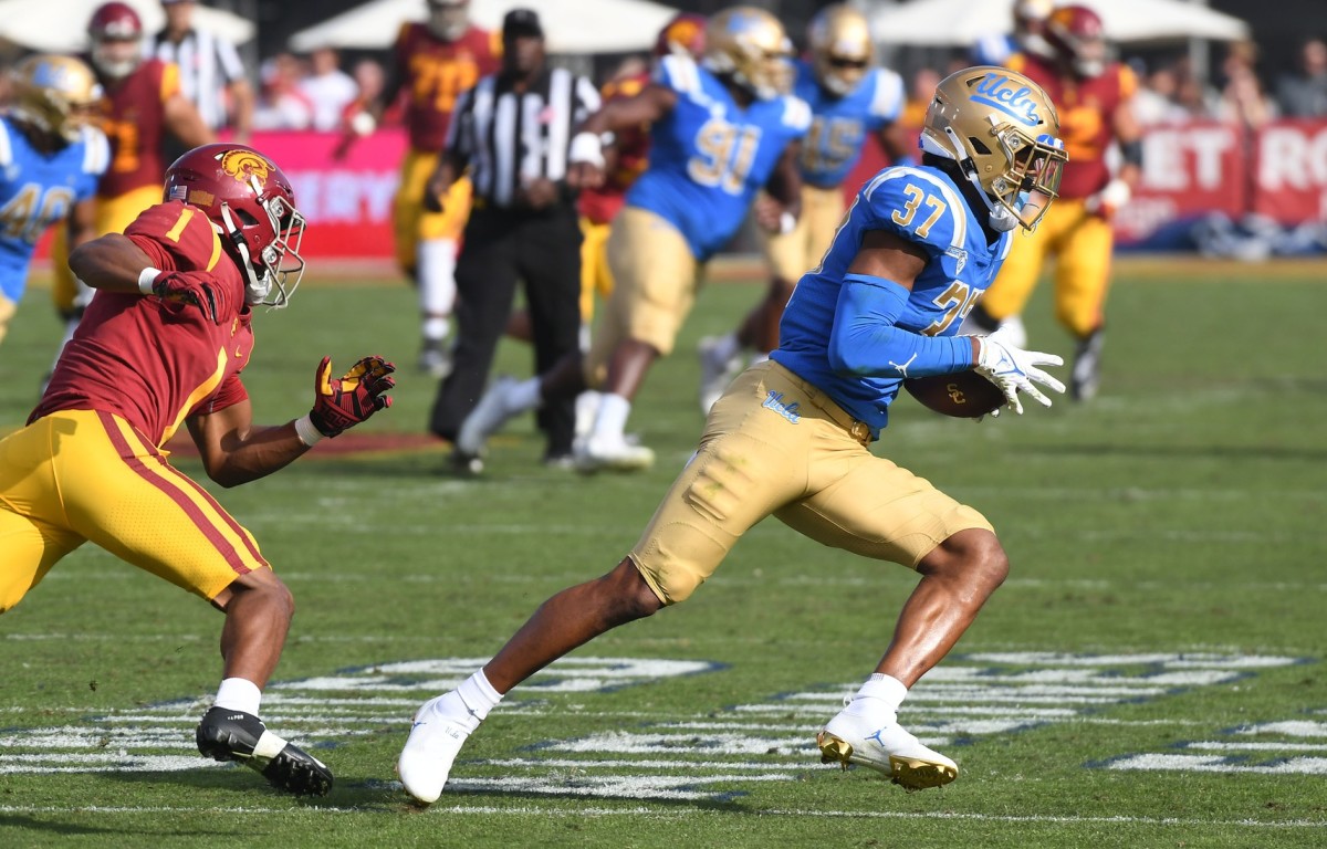 UCLA Bruins defensive back Quentin Lake (37) intercepts a pass intended for Southern California wide receiver Gary Bryant Jr. (1). Mandatory Credit: Richard Mackson-USA TODAY Sports