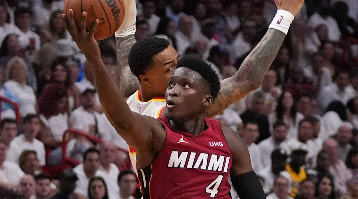 Miami Heat guard Victor Oladipo (4) puts up a shot around Atlanta Hawks forward John Collins (20) during the second half in game five of the first round for the 2022 NBA playoffs at FTX Arena.