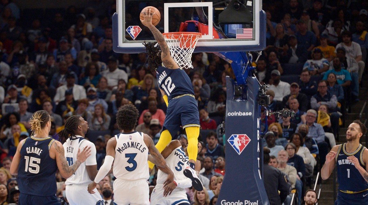 Grizzlies guard Ja Morant (12) dunks the ball against Timberwolves guard Malik Beasley (5) in the second half during Game 5.