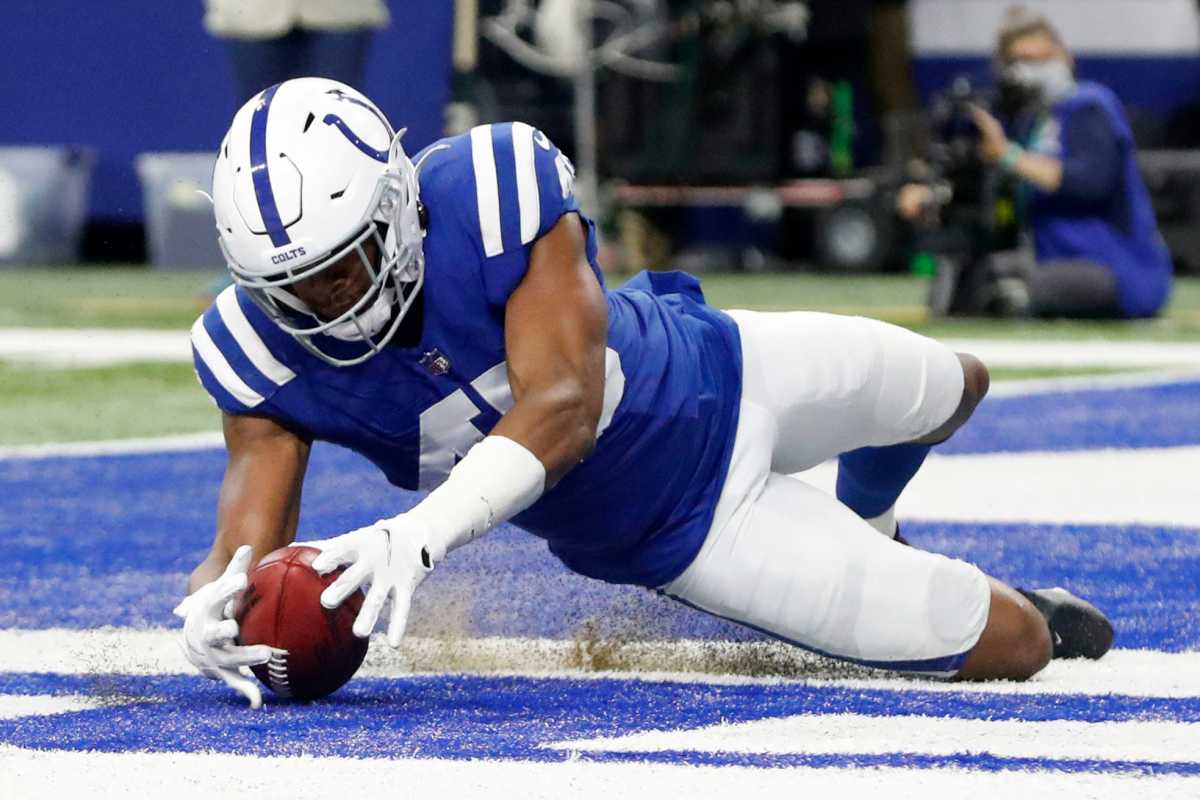 Indianapolis Colts linebacker E.J. Speed (45) rushes to dive on a blocked punt to score a touchdown Saturday, Dec. 18, 2021, during a game against the New England Patriots at Lucas Oil Stadium in Indianapolis.