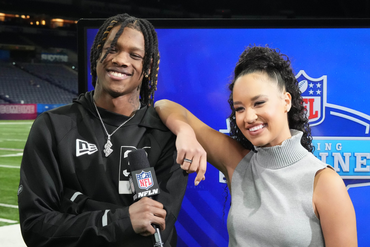 Alabama Crimson Tide wide receiver Jameson Williams (left) poses with NFL Network reporter Kimmi Chex during the NFL Scouting Combine at Lucas Oil Stadium.